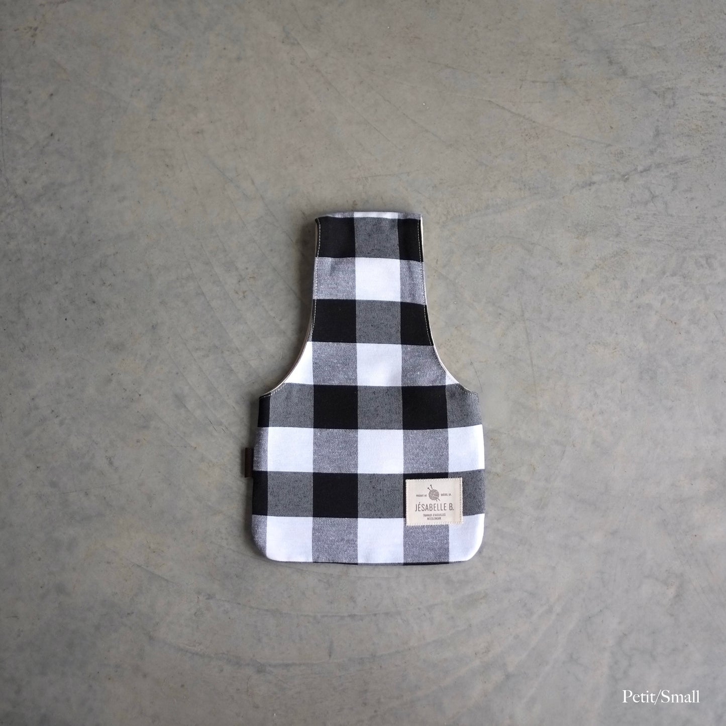 Top view of a small bag in buffalo plaid for knitting on the go
